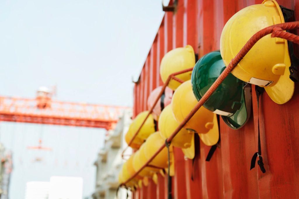 hard hats in a row at a job site